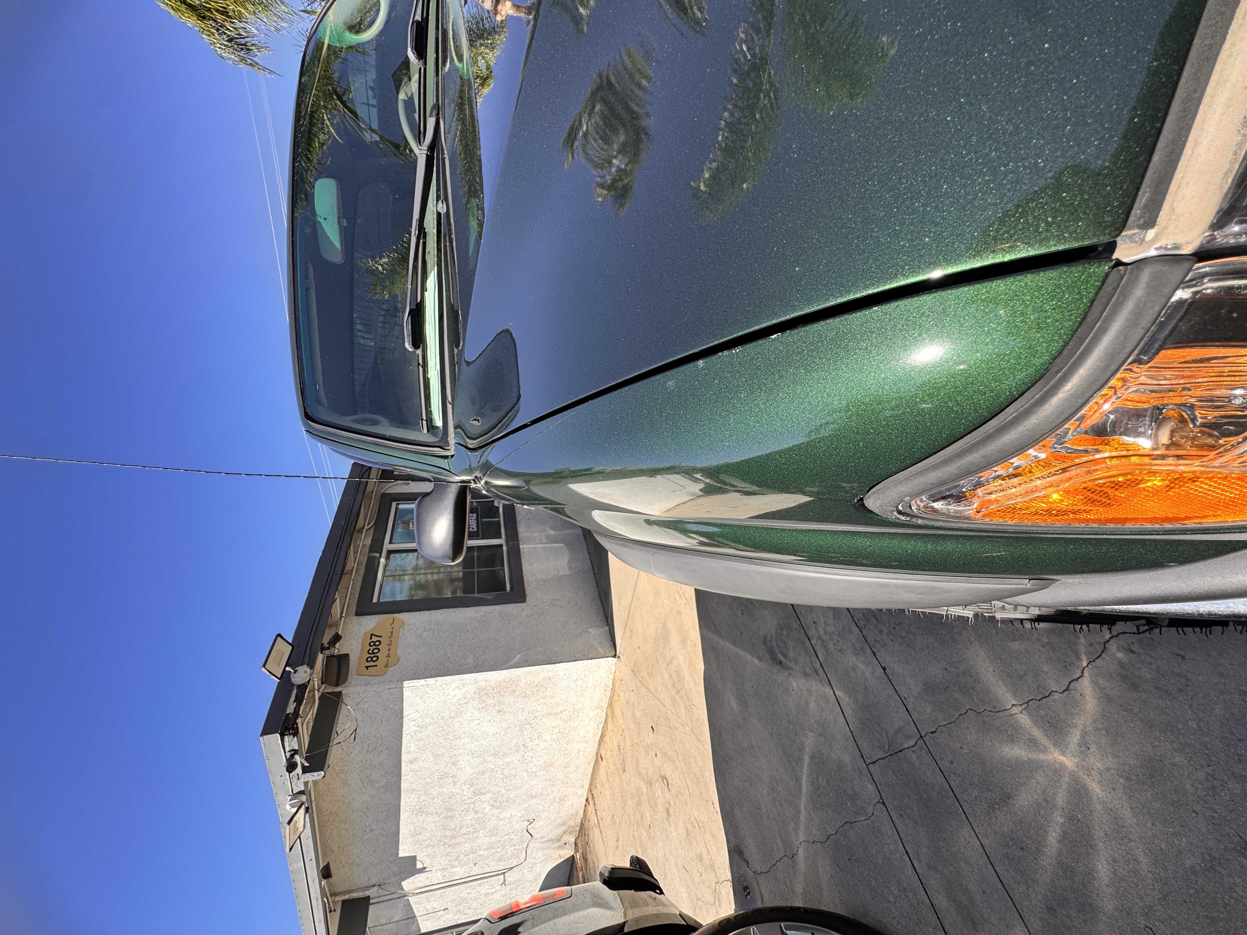 Close inspection of a worn suspension bushing and exhaust component