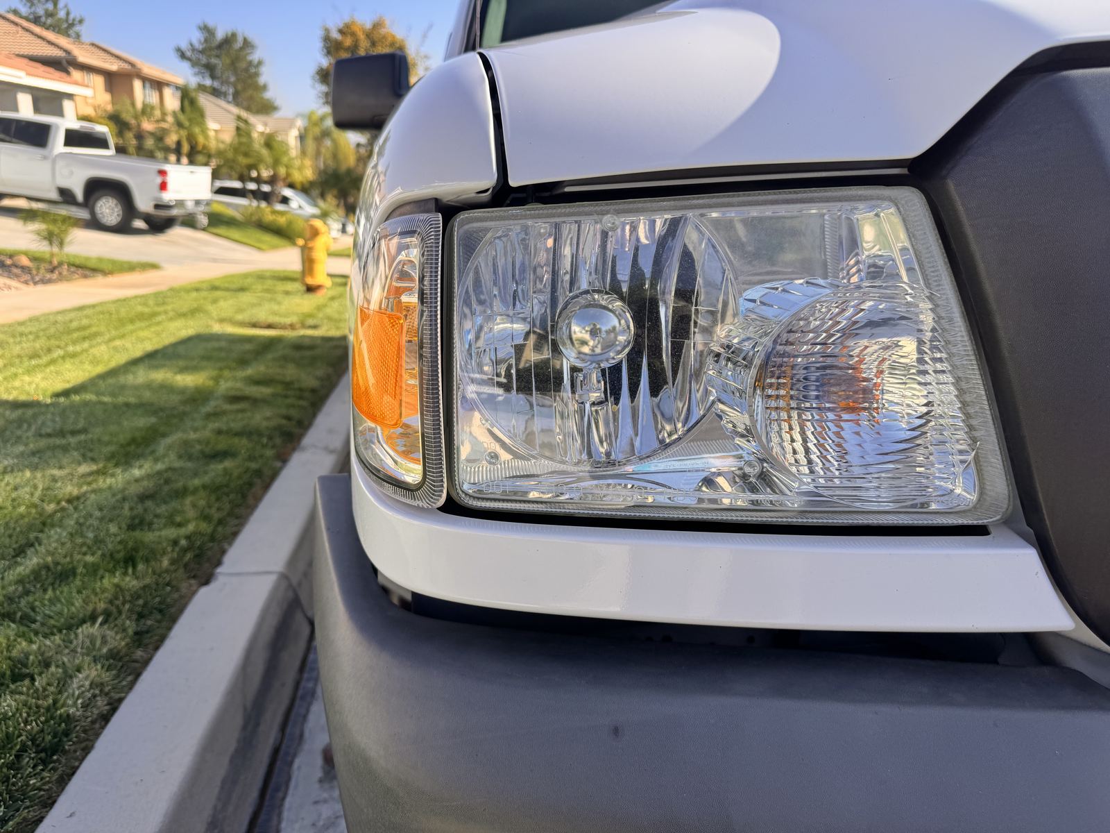 Close detail inspection of a vehicle headlight and front corner