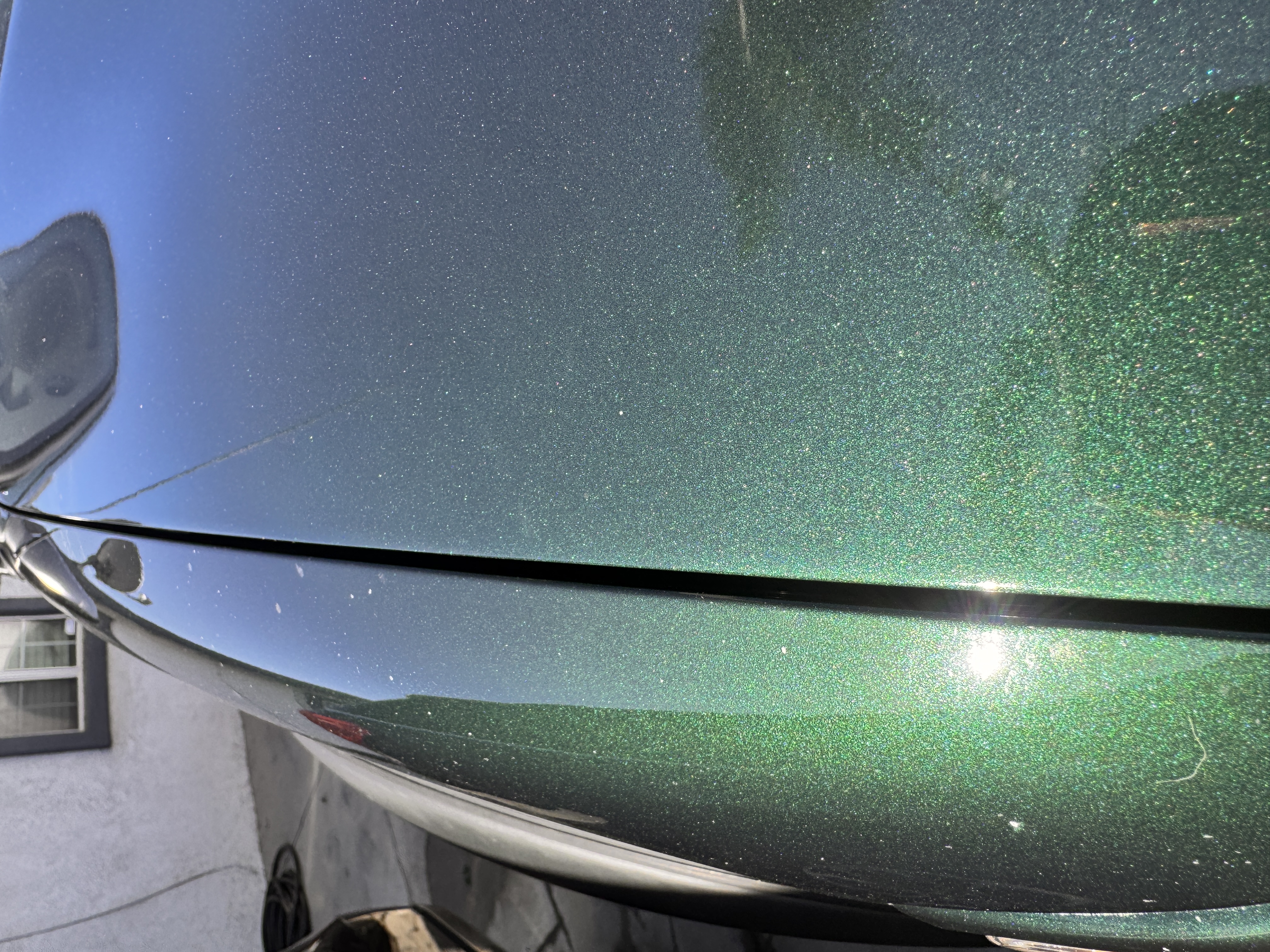 Close paint and panel-gap inspection on a vehicle body panel